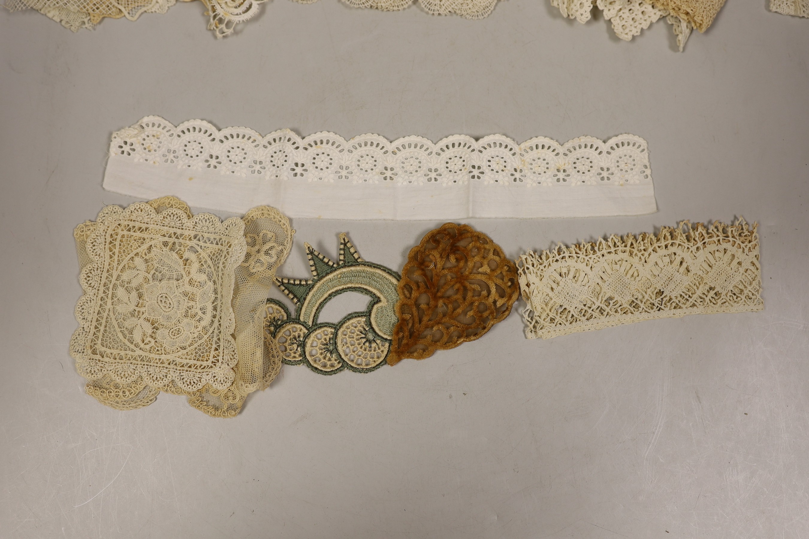 A collection of mixed 20th century lace trim, inserts and appliqués